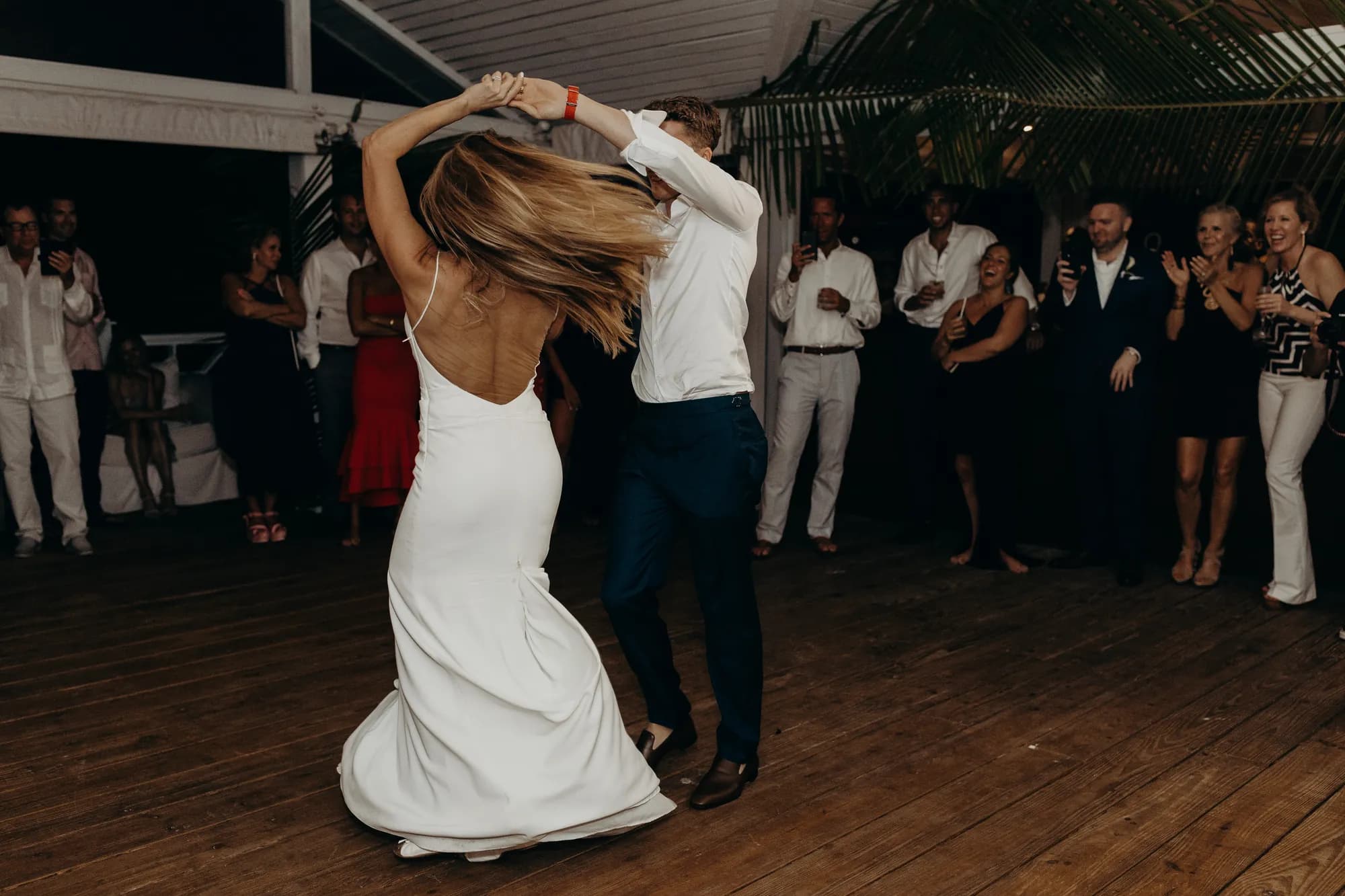 Couple spinning on the dance floor at their wedding reception