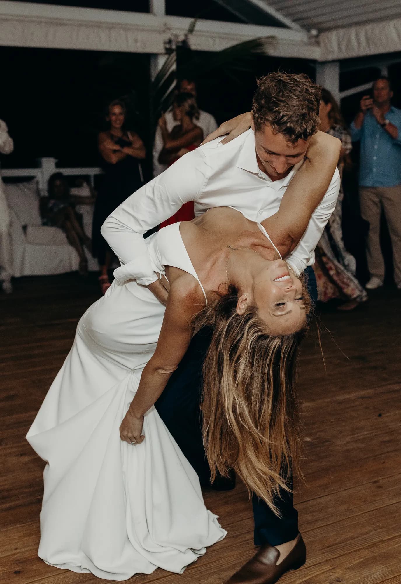 Groom dipping the bride during the first dance